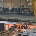 Inmigrantes solicitantes de asilo tras hacer escala en el Aeropuerto Adolfo Suárez Madrid-Barajas, en una imagen cedida por sindicatos policiales